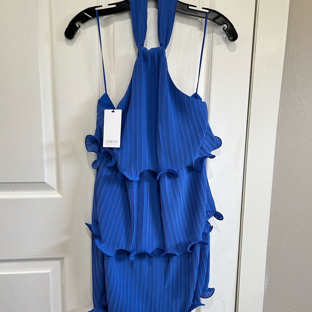 Blue cocktail/prom dress by OM33. NWT size 6.